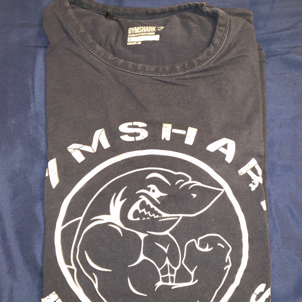 Two gymshark shirts. Blue and purple